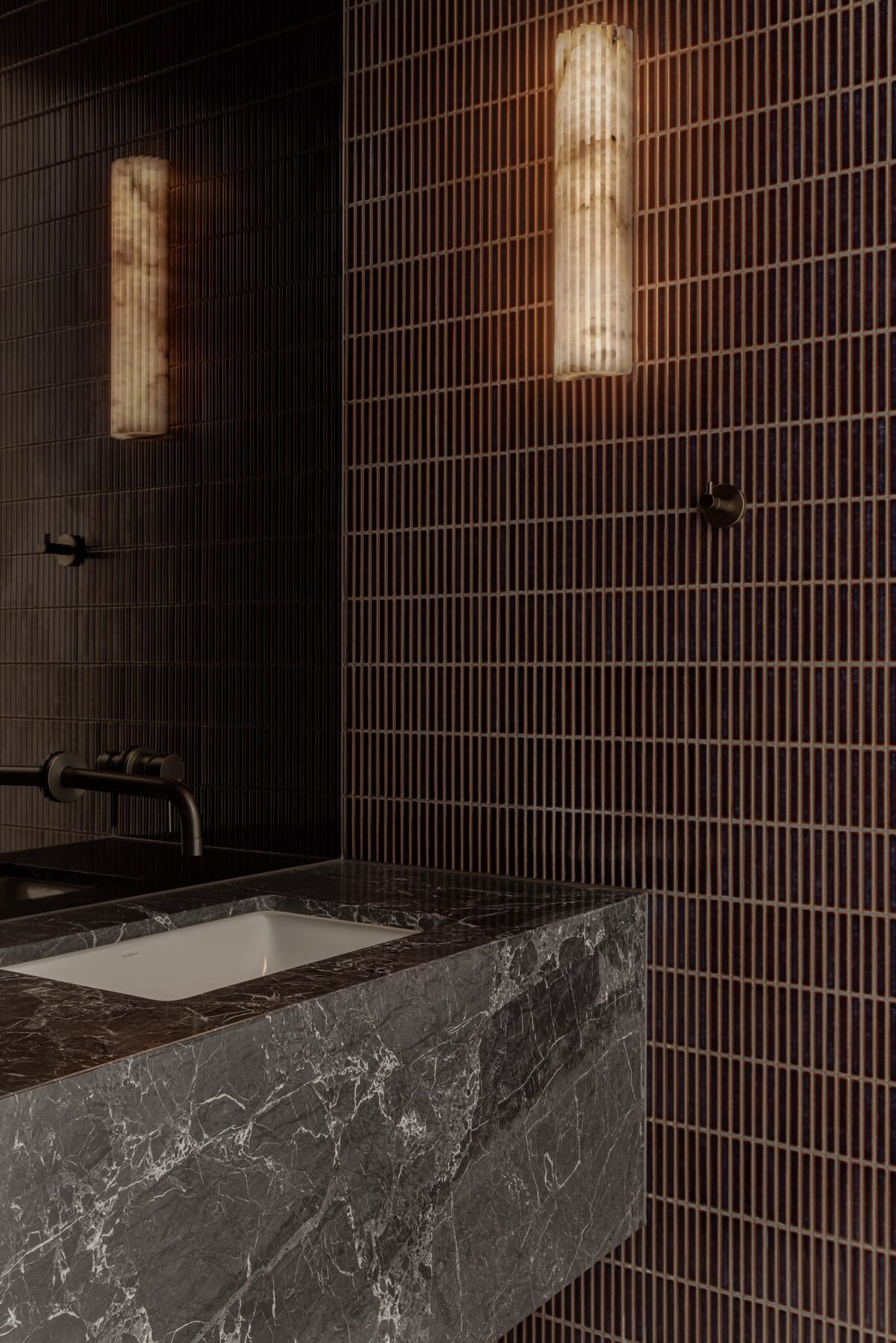 Alphington Residence — powder room with dark tiles and stone basin
